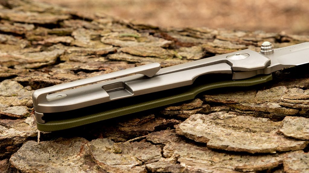 A titanium frame lock holds the Invictus-AT from Terrain 365 firmly in lockup, while the titanium clip is right-hand tip up only carry.