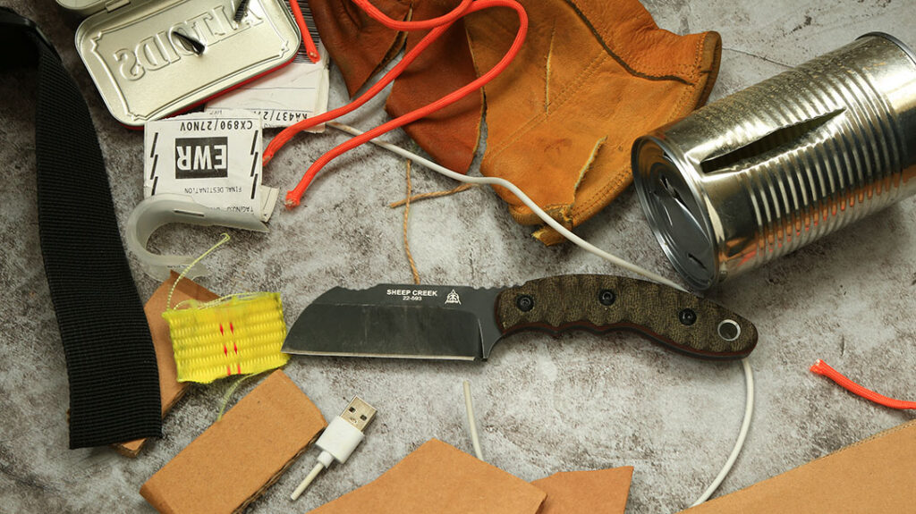 The utility gauntlet was no challenge for the TOPS Sheep Creek. It made quick work of leather, electrical cords, plastics, tow strap, and a tin can.