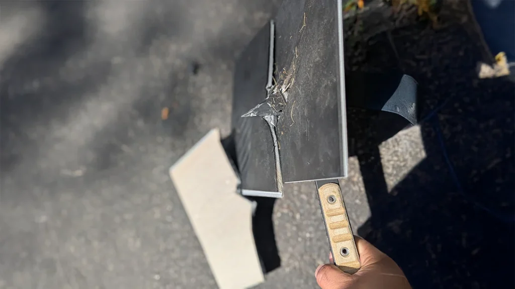 The author drove the spike through both pieces of the flooring plank. It cleared the first plank and split the second one.