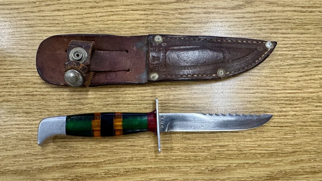 Early handmade Buck Knives knife and leather sheath.