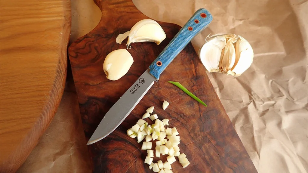 As part of the beef roast team, the Houghton Era Outdoors Cicotte was on garlic duty, slicing off that annoying root end.